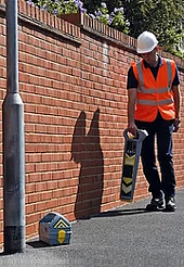 Operator Locating Street Light Cables with Radiodetection CAT4 and Genny4 